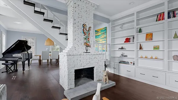 a kitchen with stainless steel appliances granite countertop a refrigerator a sink and a stove