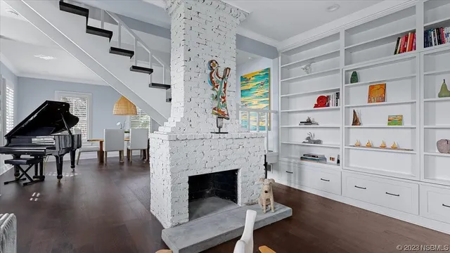 a kitchen with stainless steel appliances granite countertop a refrigerator a sink and a stove