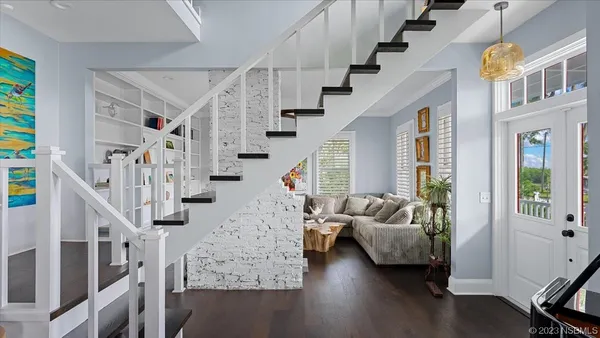 a kitchen with stainless steel appliances granite countertop a kitchen island a stove a table and chairs in it