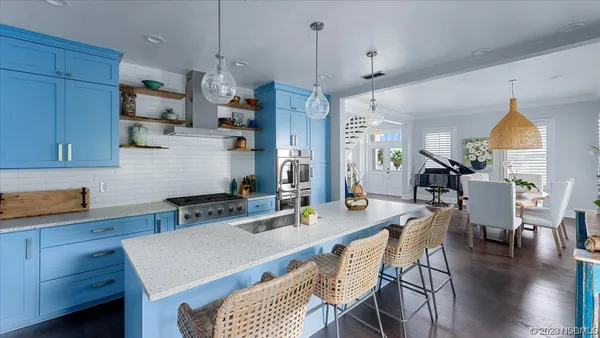 a view of a bedroom with a window and wooden floor