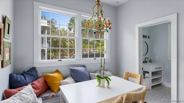 a view of a porch with wooden floor and fence