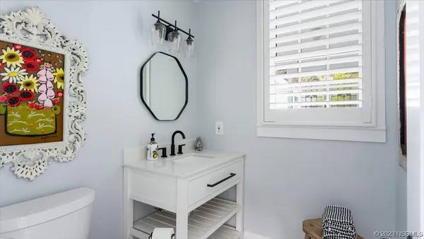 a bedroom with a bed and a desk