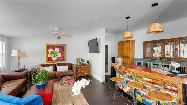 a kitchen with stainless steel appliances granite countertop a stove top oven a sink dishwasher and cabinets with wooden floor