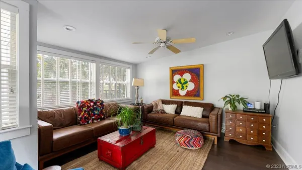 a living room with furniture and a flat screen tv