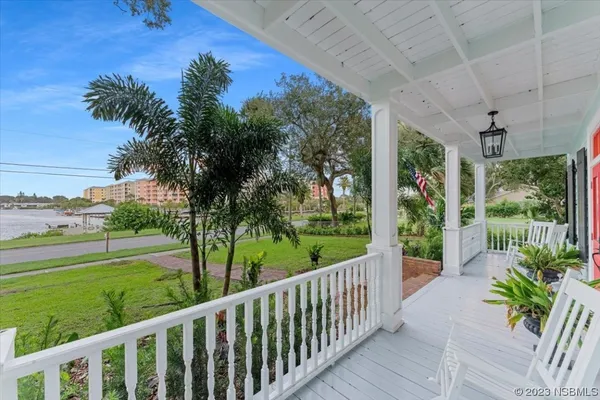 a living room with furniture a fireplace and a window