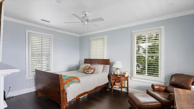 a kitchen with a sink cabinets and wooden floor