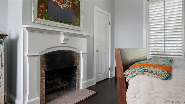 a view of a livingroom with workspace and a window