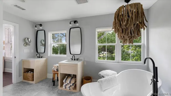 a view of swimming pool with outdoor seating and lake view