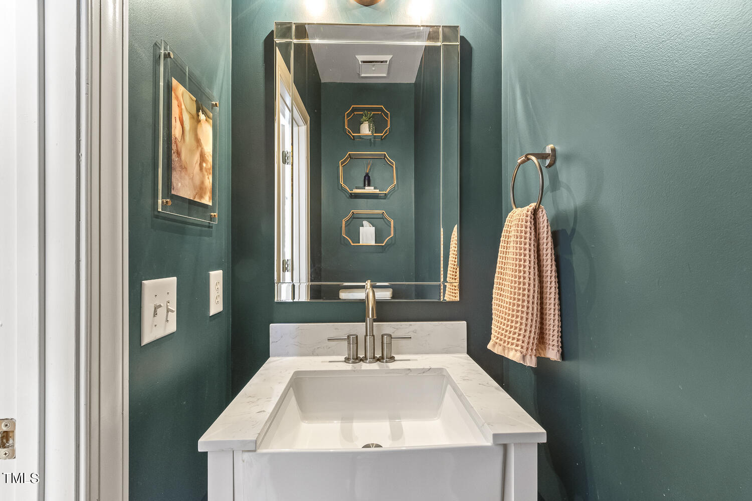 6409 Nowell Pointe Drive Raleigh, NC 27607 - Photo 18 of 29 a bathroom with a sink and a mirror