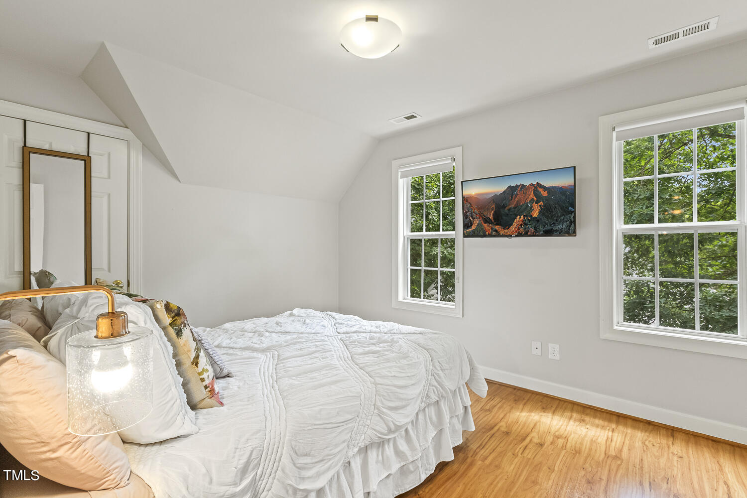 6409 Nowell Pointe Drive Raleigh, NC 27607 - Photo 25 of 29 a bedroom with a bed and a window