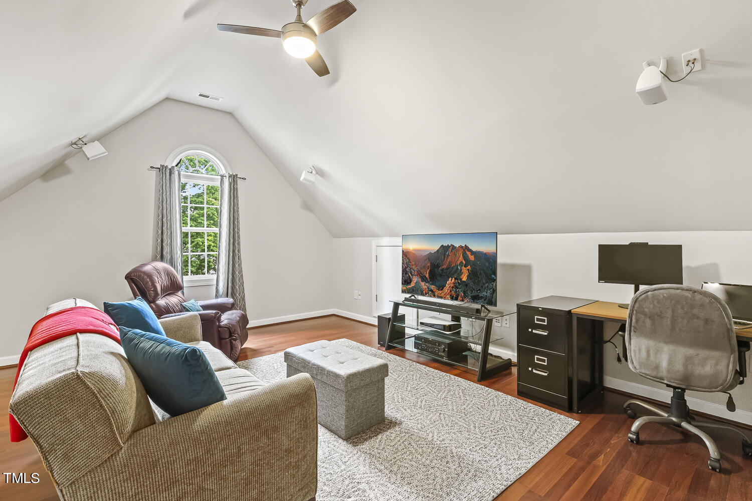 6409 Nowell Pointe Drive Raleigh, NC 27607 - Photo 26 of 29 a living room with furniture and a flat screen tv