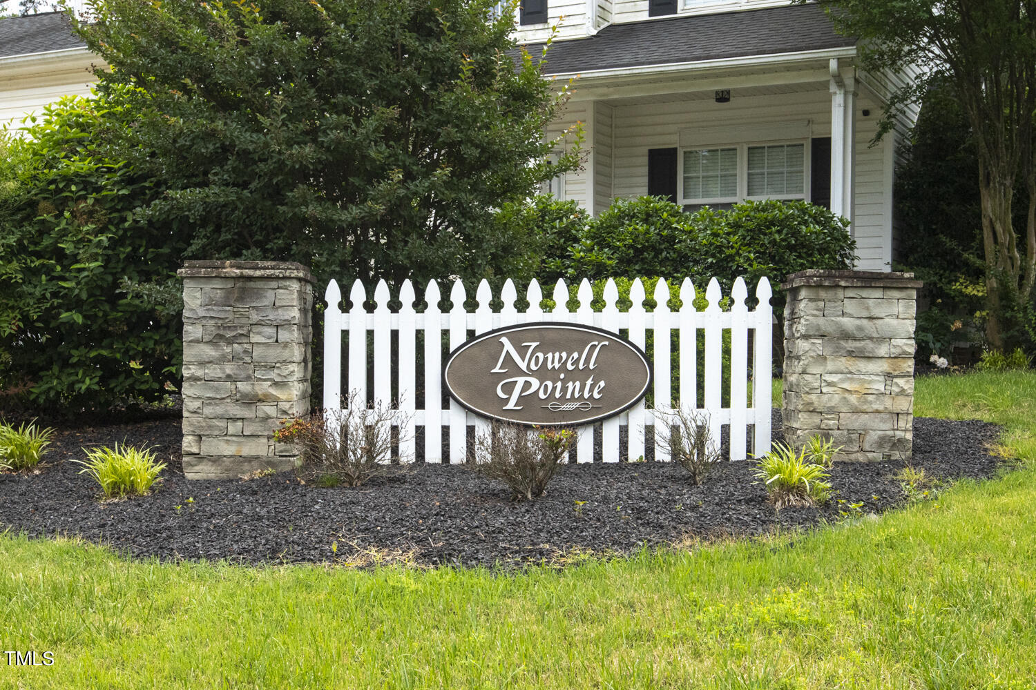 6409 Nowell Pointe Drive Raleigh, NC 27607 - Photo 28 of 29 a front view of a house with a yard