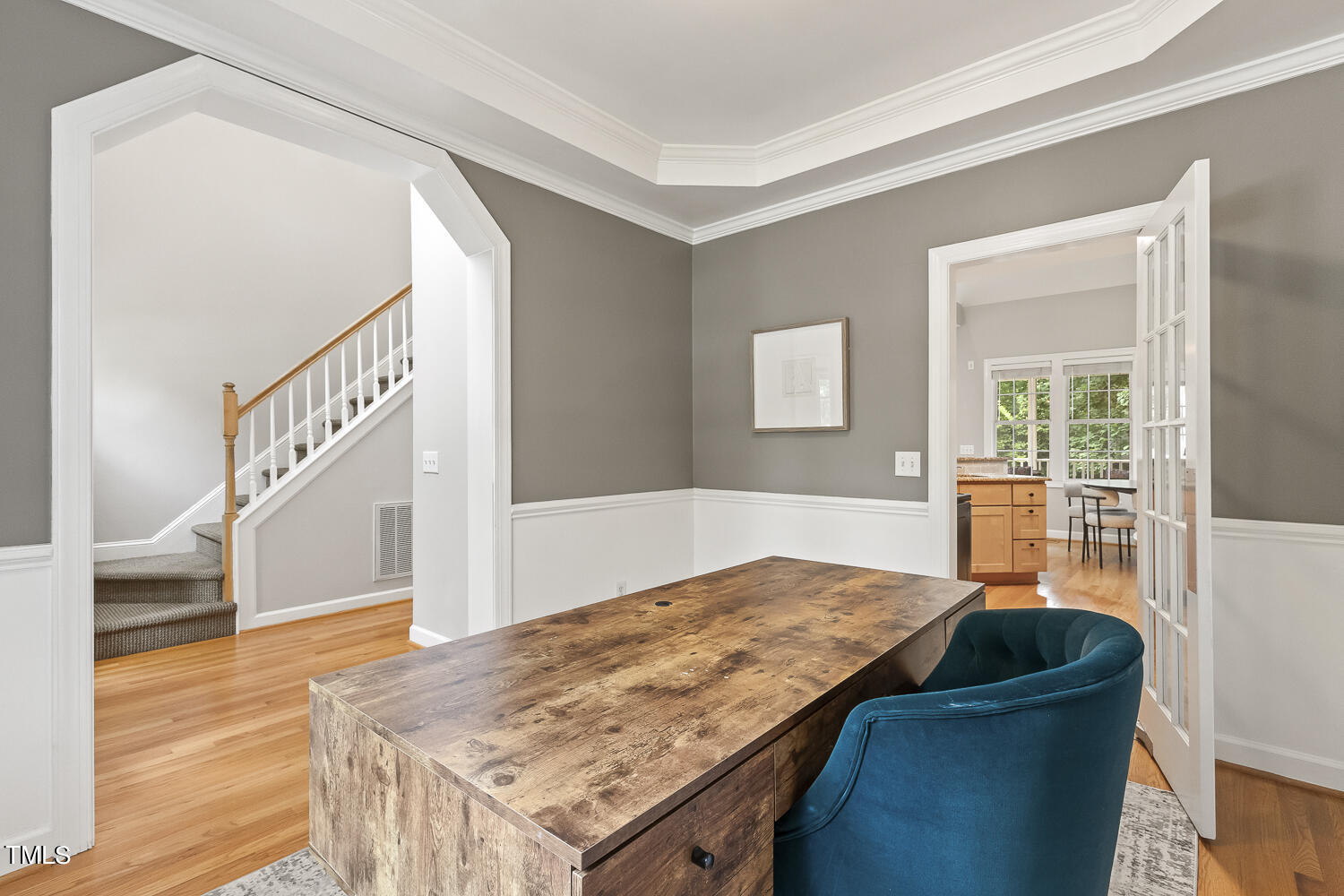 6409 Nowell Pointe Drive Raleigh, NC 27607 - Photo 7 of 29 a bedroom with a bed and wooden floor