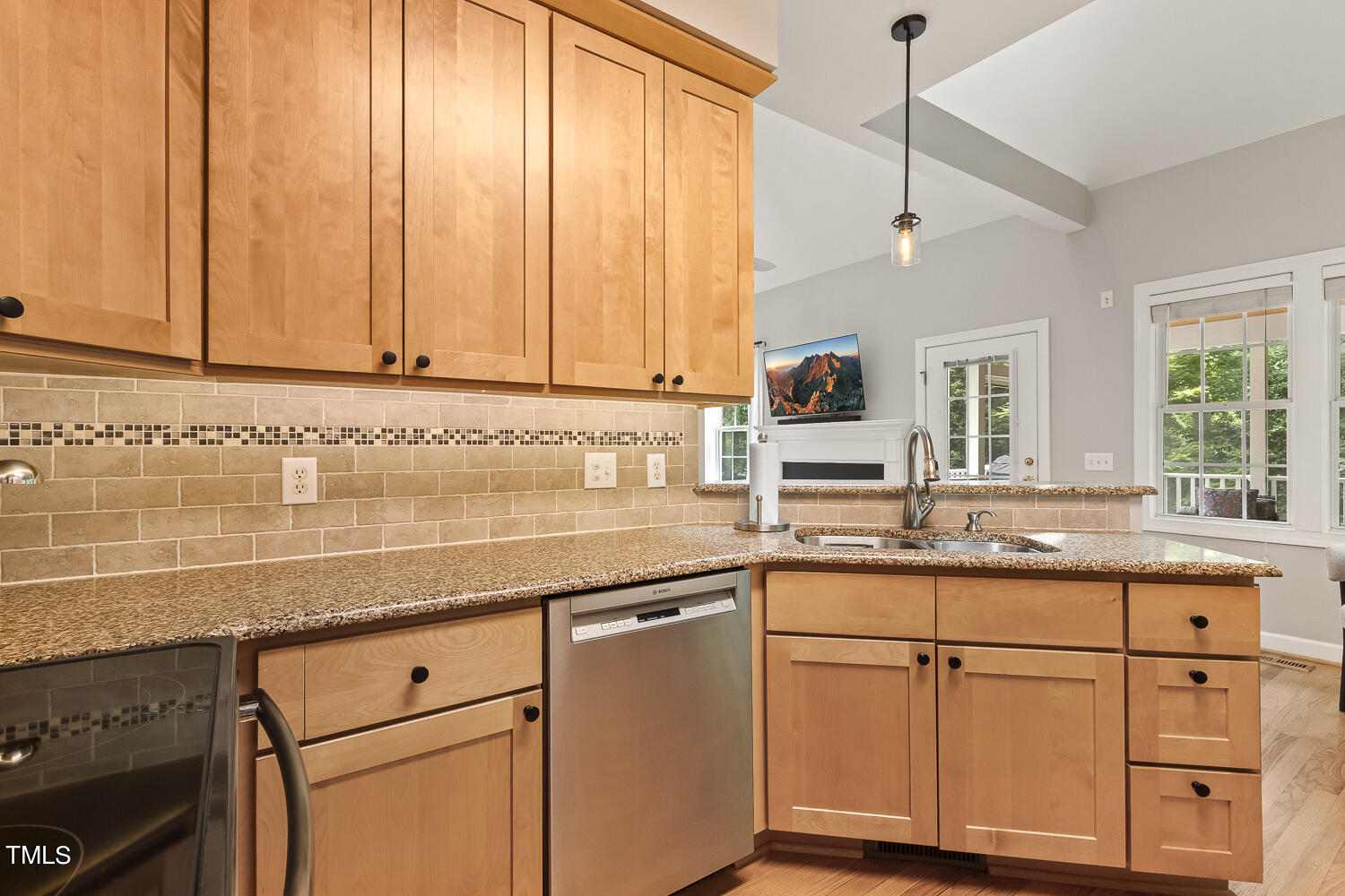 6409 Nowell Pointe Drive Raleigh, NC 27607 - Photo 10 of 29 a kitchen with granite countertop white cabinets and white appliances
