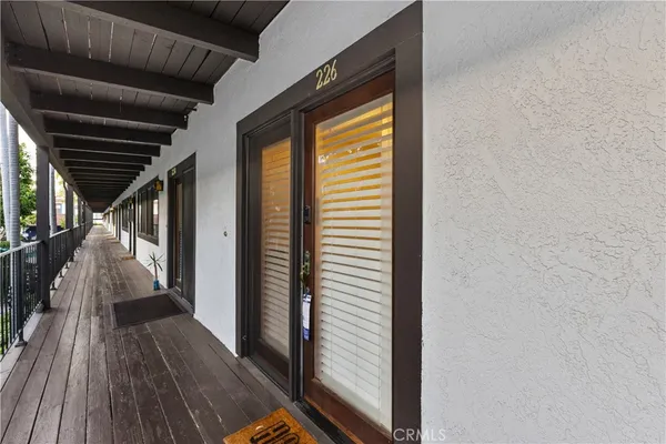 a view of balcony and wooden floor