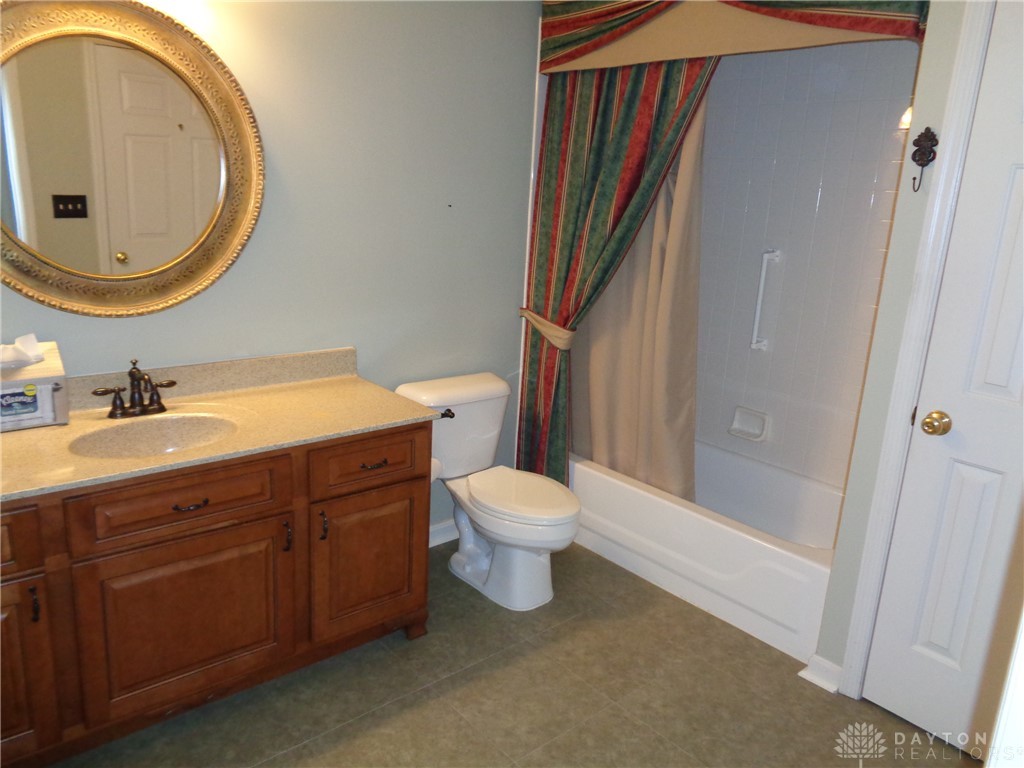 80 Villa Pointe Drive Springboro, OH 45066 - Photo 17 of 19 This functional bathroom features a shower, bathtub combination, and a vanity for daily routines.