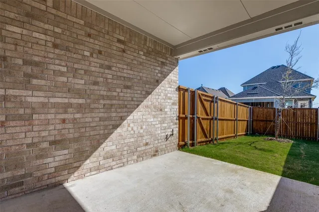 a view of backyard with small cabin