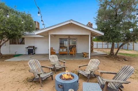 a view of a backyard with furniture