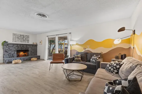 a living room with furniture and a fireplace