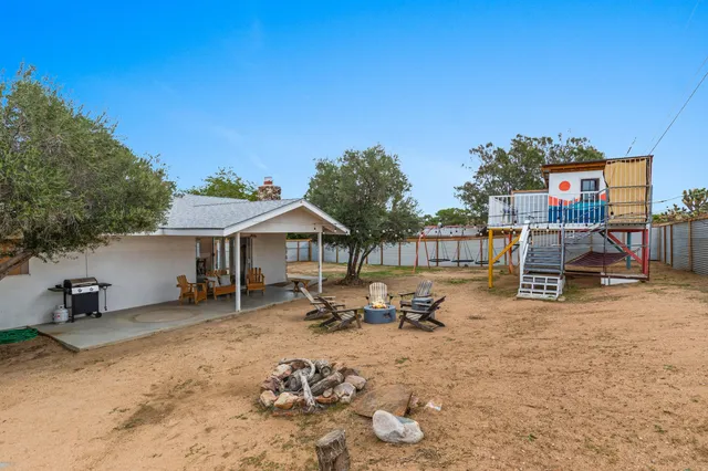 a view of a backyard with furniture