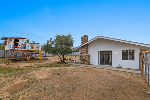 a house with trees in the background