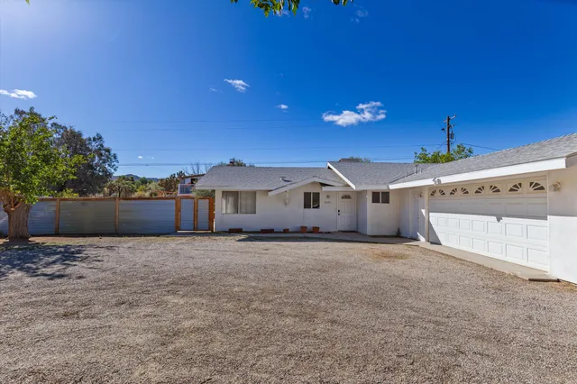 a view of a house with a big yard