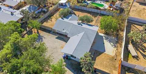 an aerial view of a house with outdoor space