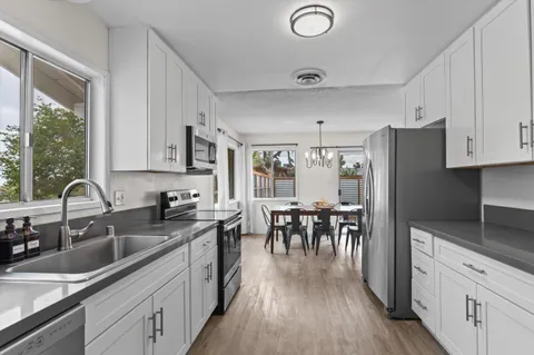 a view of a dining room with furniture window and outside view