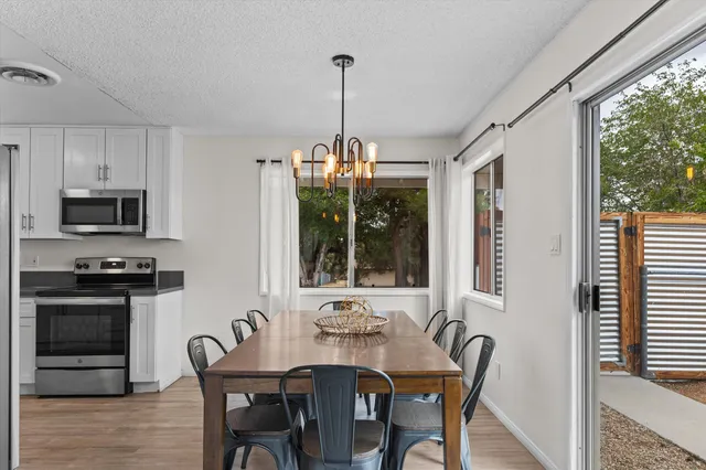 a view of a dining room with furniture window and outside view