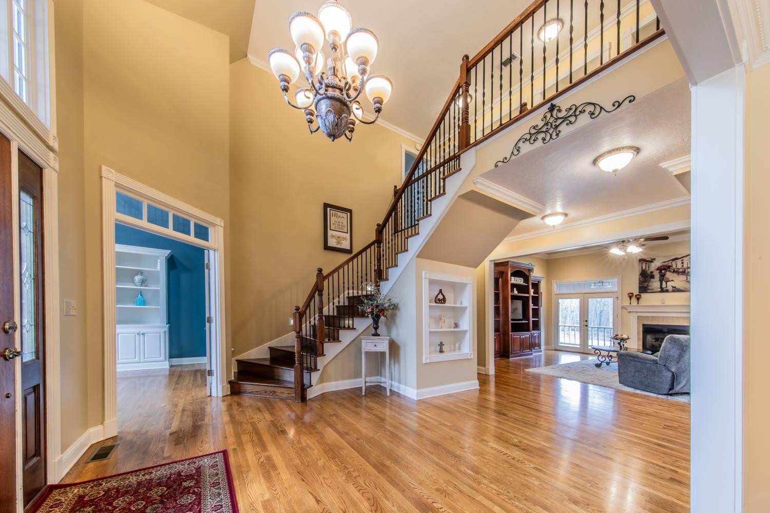 904 Templeton Road Martin, TN 38237 - Photo 2 of 42 a view of a livingroom with a dinning area stairs and a chandelier