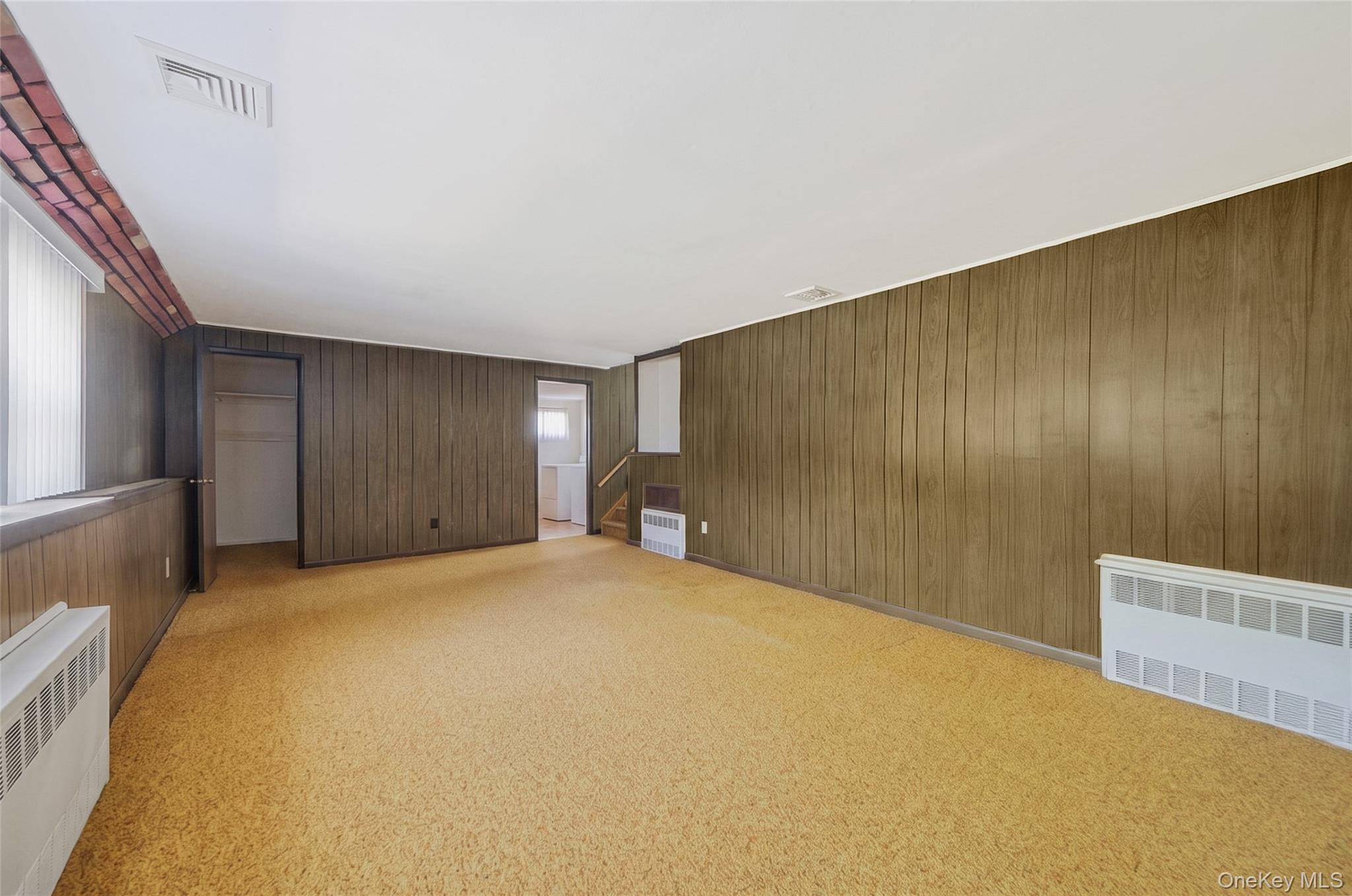 59 Maybrook Road North Babylon, NY 11703 - Photo 22 of 43 a view of an empty room with a window