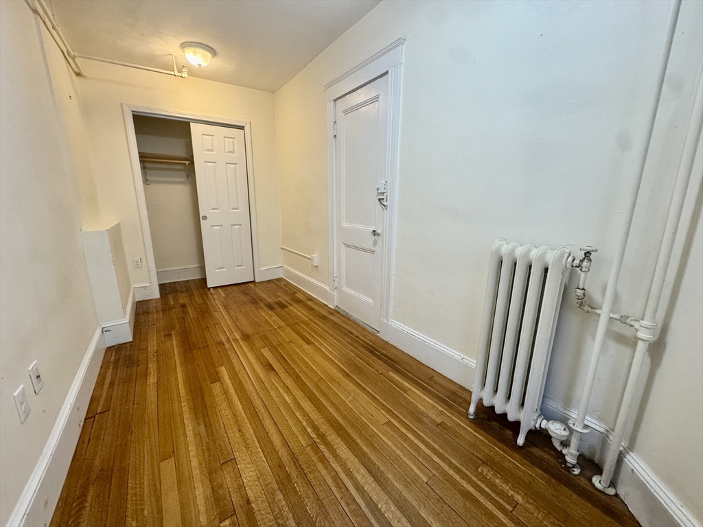 1615 Commonwealth Avenue, Unit 11 Boston, MA 02135 - Photo 6 of 9 a view of a room with wooden floor