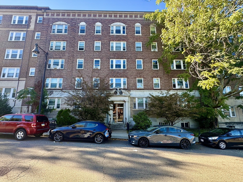 1615 Commonwealth Avenue, Unit 11 Boston, MA 02135 - Photo 9 of 9 a car parked in front of a building