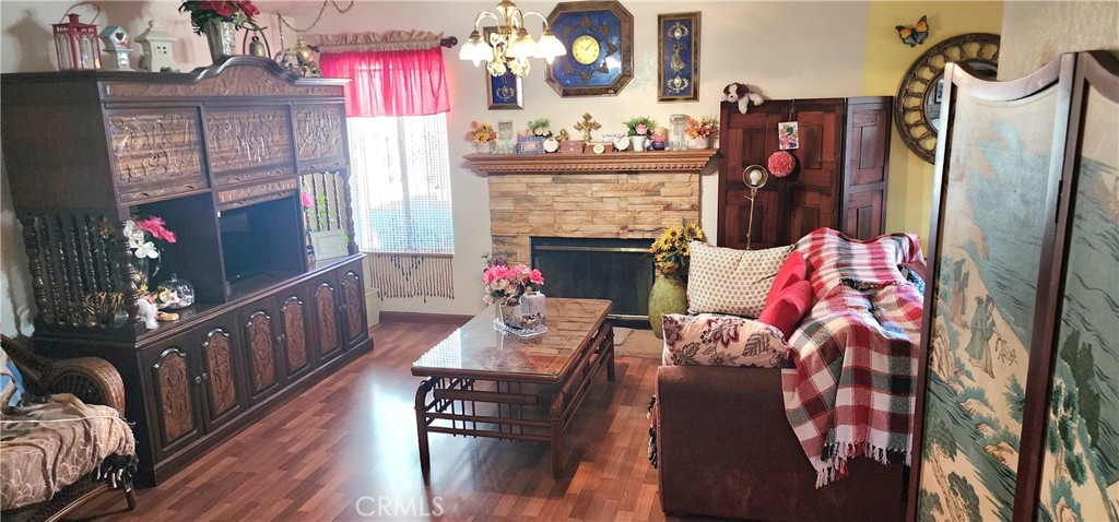 a view of living room with furniture and fireplace