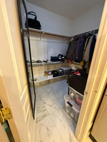 a kitchen with a refrigerator and a sink