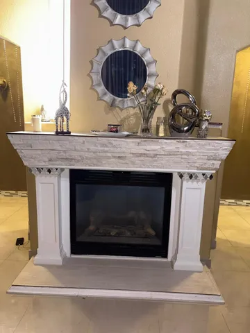 a stove top oven sitting inside of a kitchen