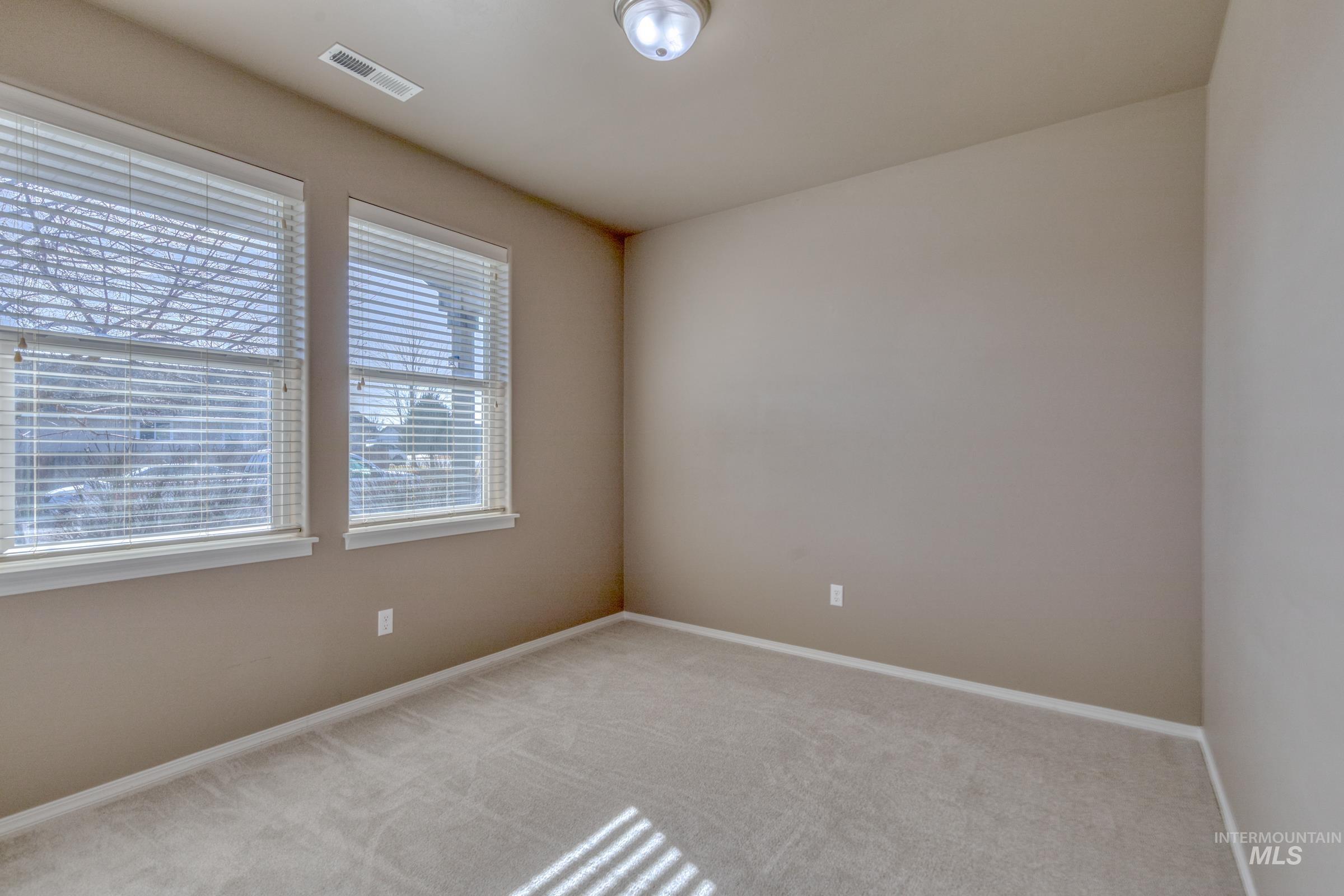 12734 Amber Sky Drive Caldwell, ID 83607 - Photo 18 of 28 Unfurnished room with carpet floors and baseboards