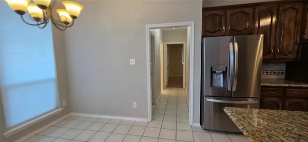 a kitchen with stainless steel appliances granite countertop cabinets and glass door