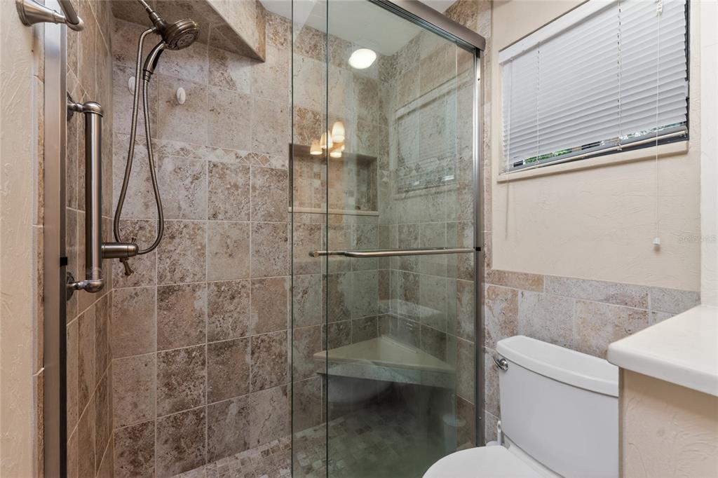 2955 North Beach Road, Unit B614 Englewood, FL 34223 - Photo 28 of 67 a bathroom with a shower and toilet