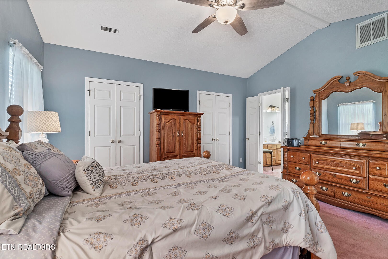 449 Foss Road Maryville, TN 37801 - Photo 27 of 49 a bedroom with a large bed and a dresser