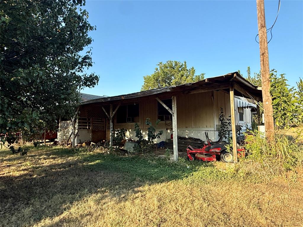 9620 Valley Road Joshua, TX 76058 - Photo 7 of 11 a view of two chairs and a table in the backyard