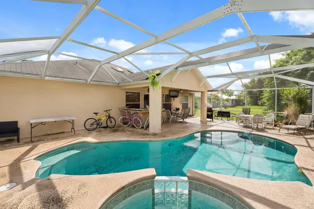 a view of a backyard with sitting area