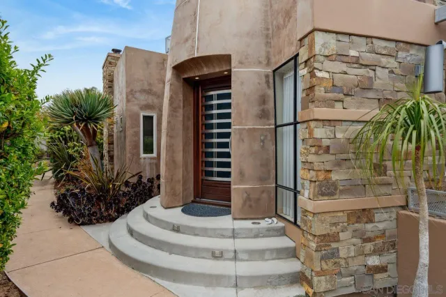 a kitchen with stainless steel appliances kitchen island granite countertop a sink and cabinets