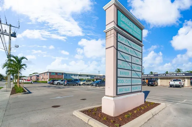 a street with view of building and car parked