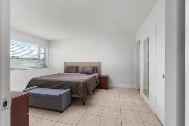 a room with a bed and a window