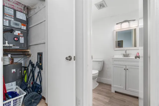 a bathroom with a toilet sink and shower
