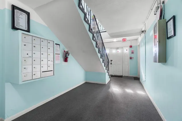 a view of a hallway with staircase