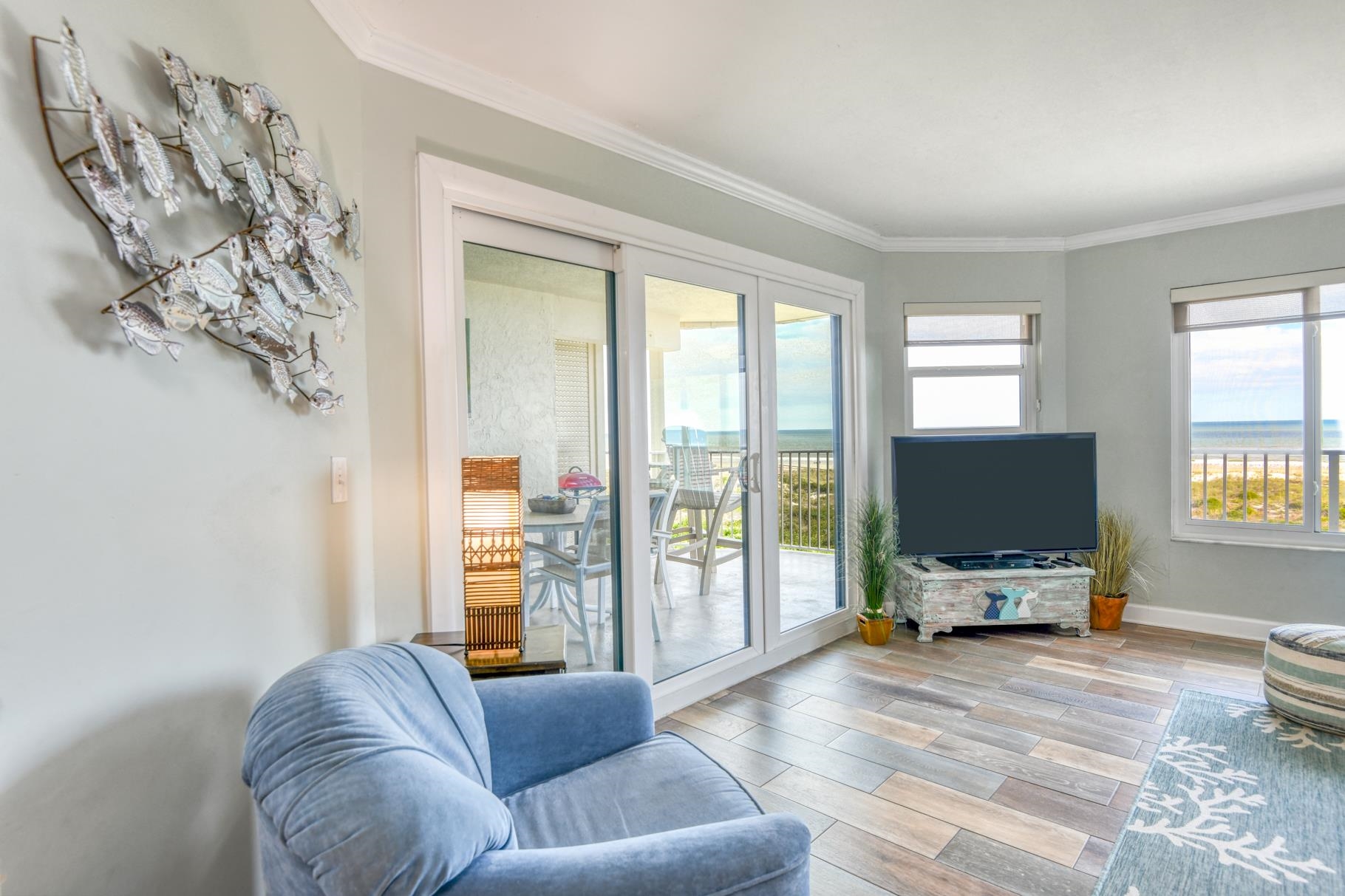 4670 A1A South, Unit 1402 St. Augustine, FL 32080 - Photo 11 of 47 a living room with furniture and large flat screen tv
