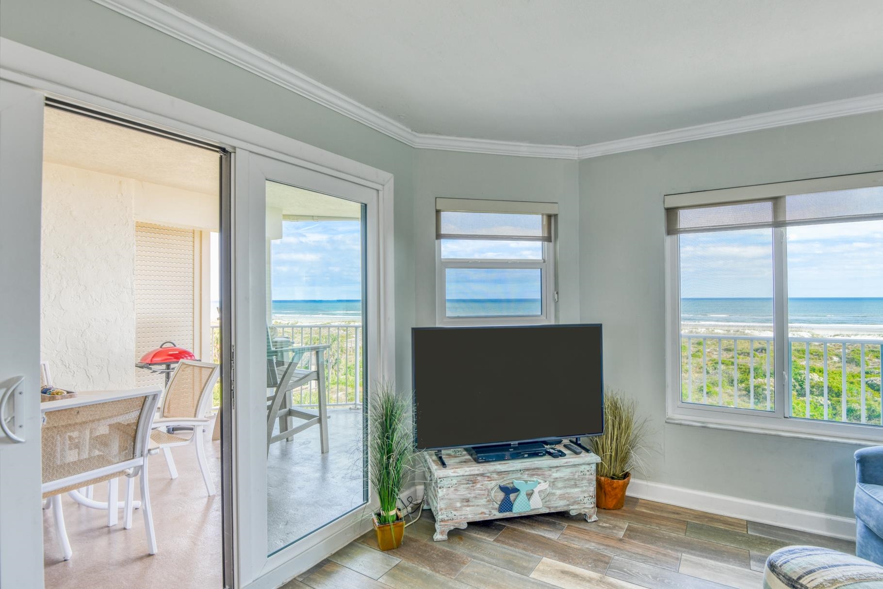 4670 A1A South, Unit 1402 St. Augustine, FL 32080 - Photo 12 of 47 a living room with furniture and a flat screen tv