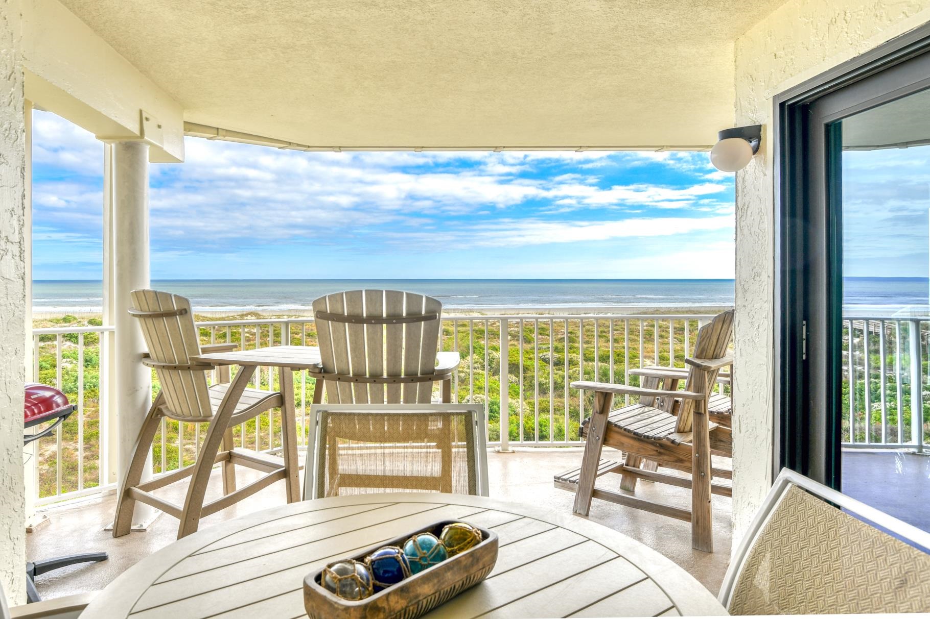 4670 A1A South, Unit 1402 St. Augustine, FL 32080 - Photo 13 of 47 a view of a balcony with wooden floor and outdoor space